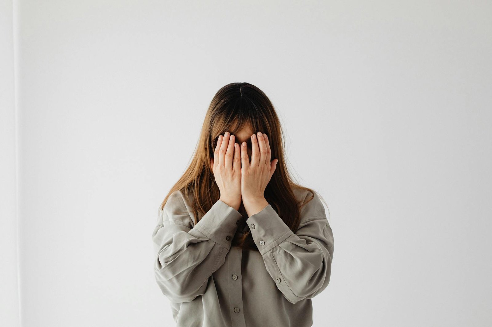 woman with hands on face
