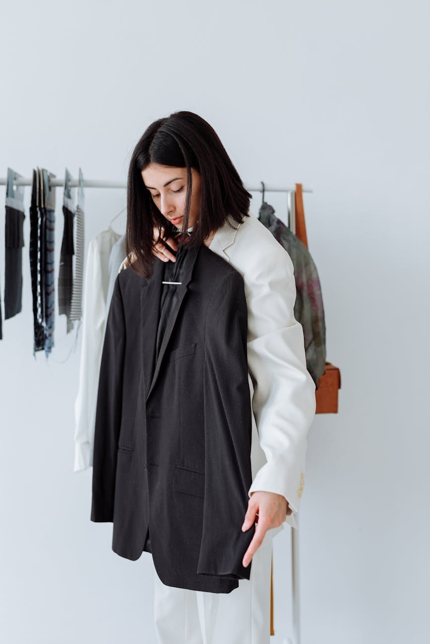 a woman holding a black coat