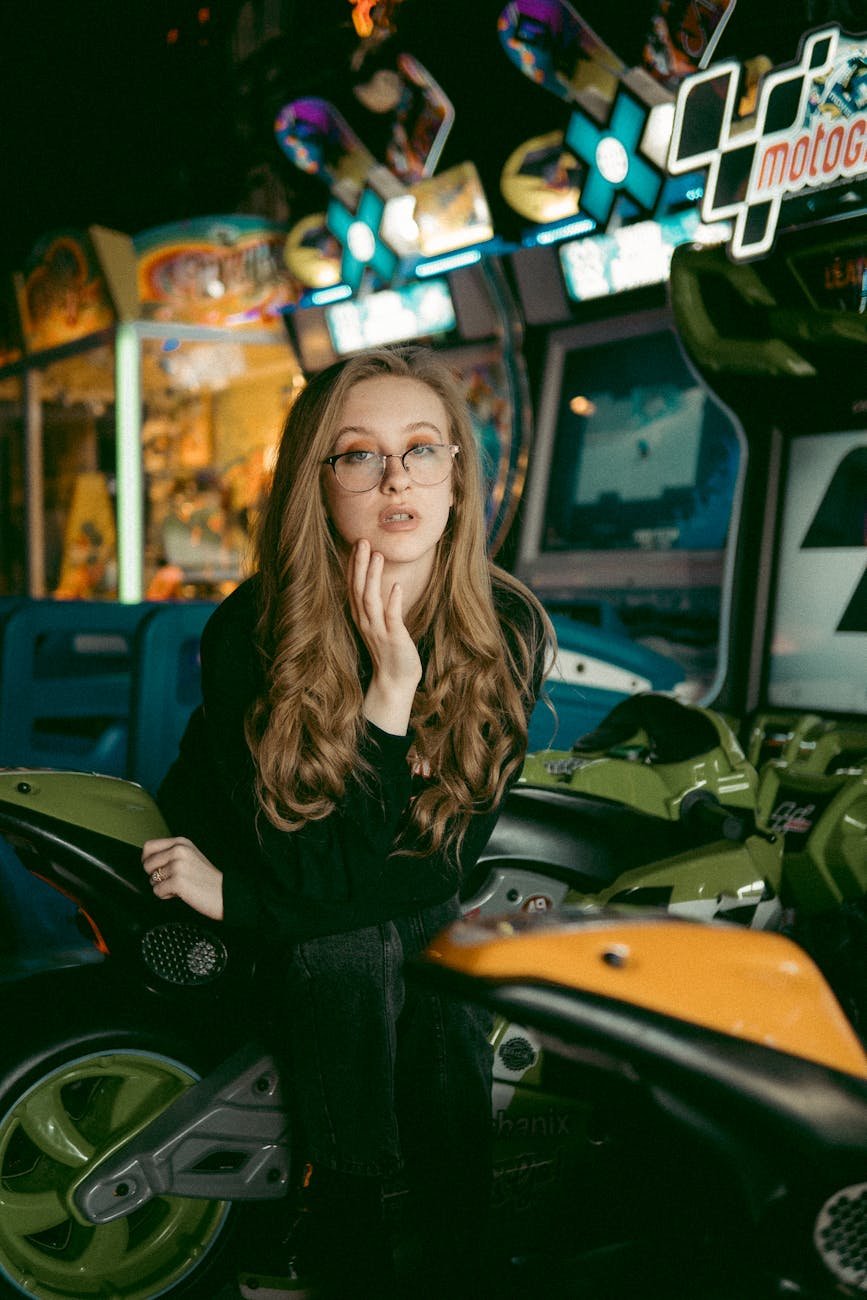 woman sitting on green motorcylce