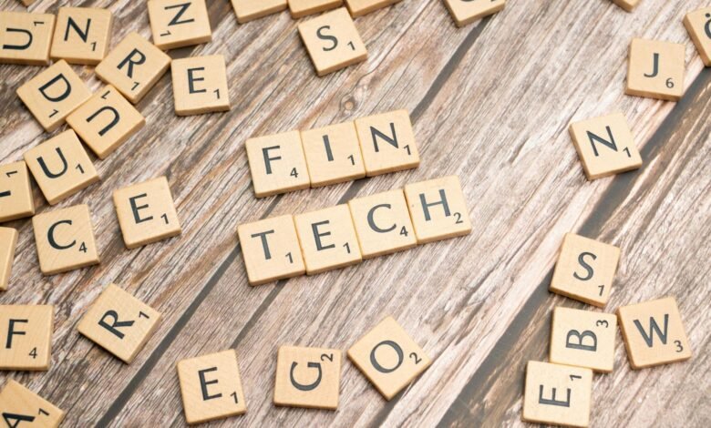 scrabble tiles spelling out the word fin tech