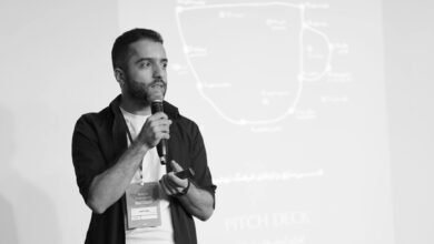 man presenting pitch deck in seminar