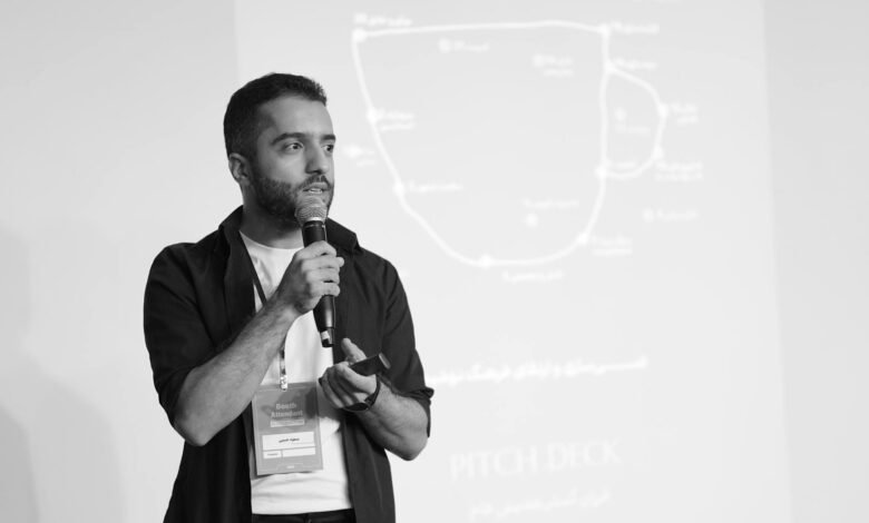man presenting pitch deck in seminar