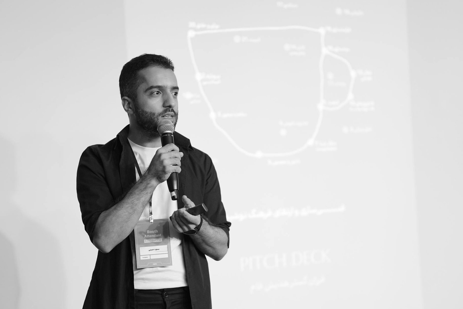 man presenting pitch deck in seminar