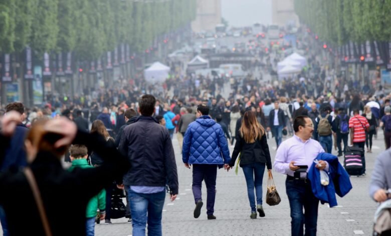bustling crowd along champs elysees paris