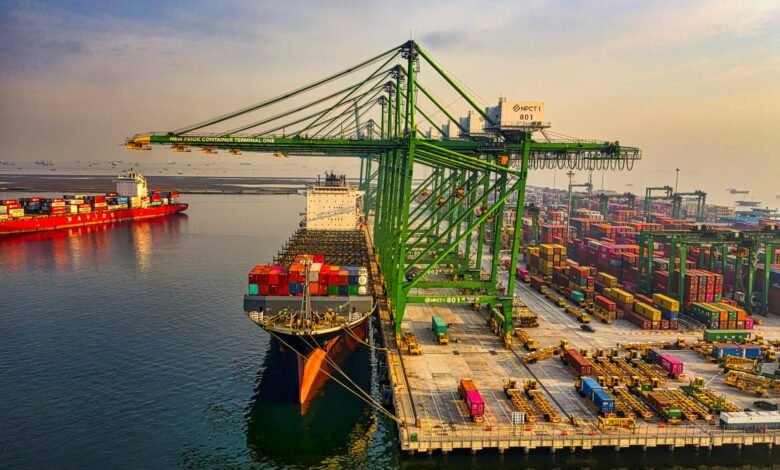 drone shot of a docked cargo ship at a port