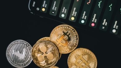bitcoins beside a phone