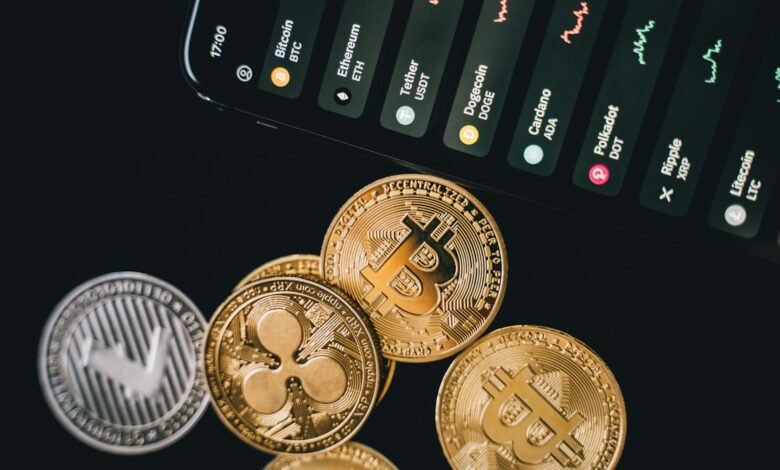 bitcoins beside a phone