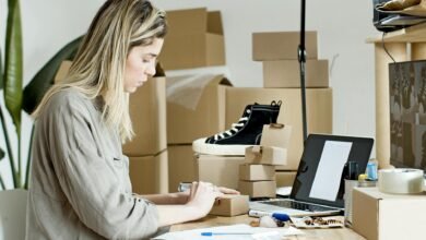 woman using brown box for packaging
