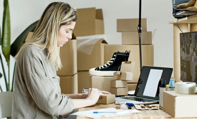 woman using brown box for packaging