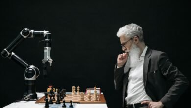elderly man thinking while looking at a chessboard