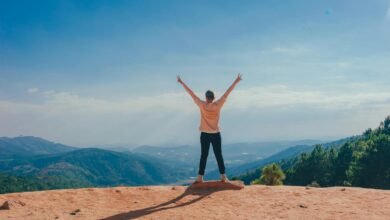 woman standing on cliff