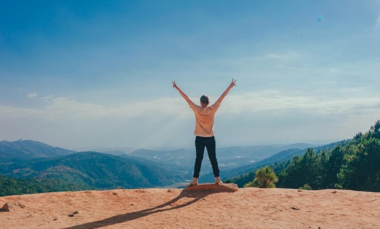 woman standing on cliff