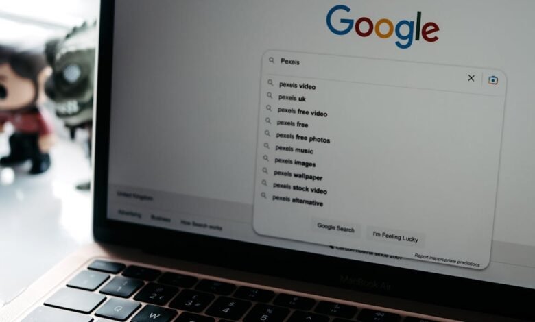 photo of a laptop screen with google main page on it