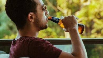 man sitting and drinking beer