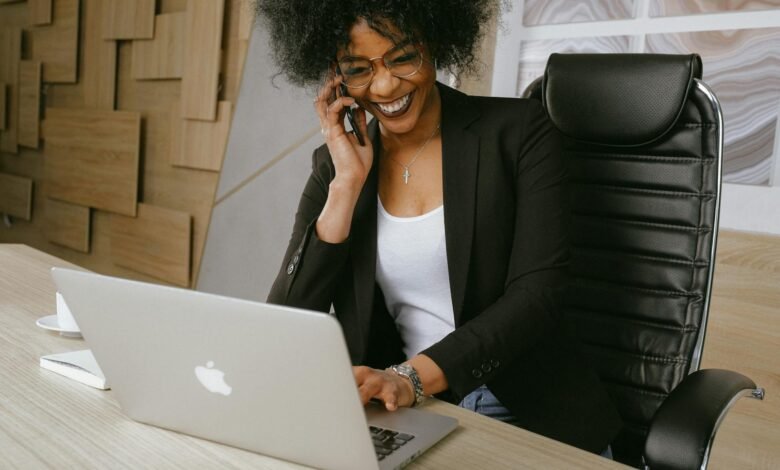 woman in black blazer sitting on black office chair