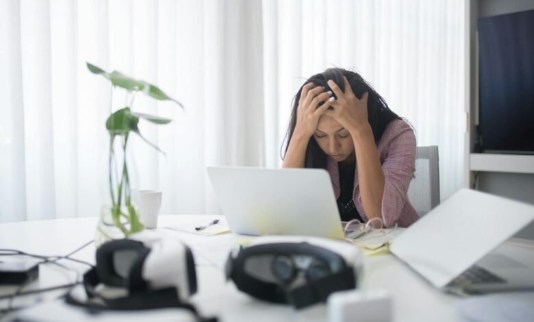photo of a stressed woman at work