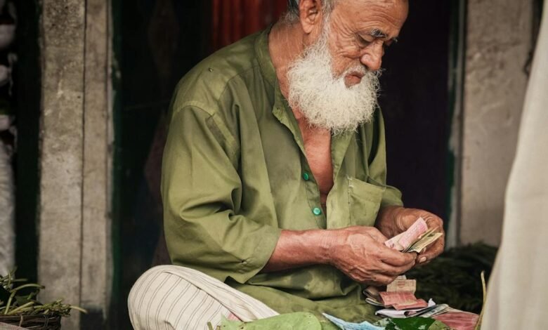 elderly vendor selling betel leaves at market