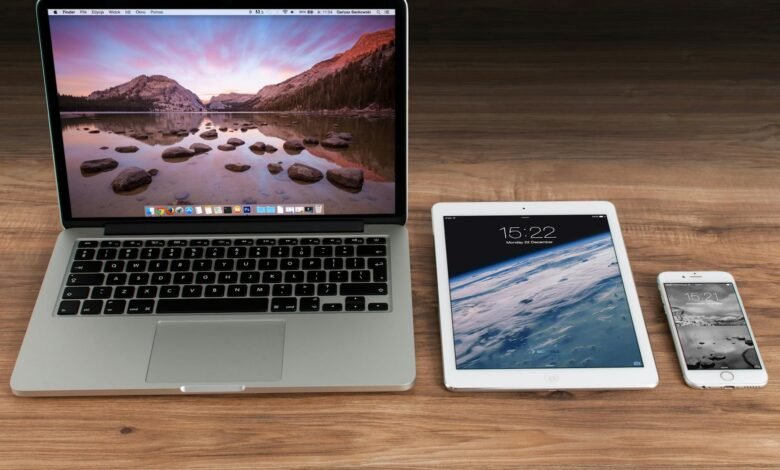 macbook pro beside white ipad