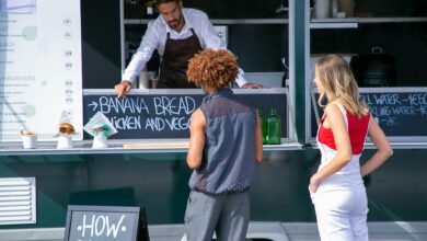 ethnic seller suggesting food to diverse clients