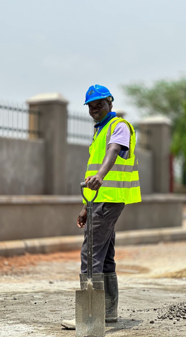 construction worker holding shovel outdoors