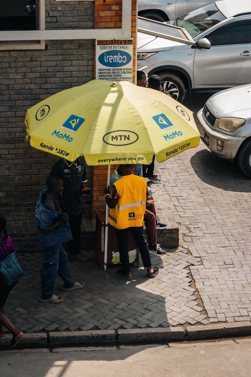 street vending scene under mtn yellow umbrella