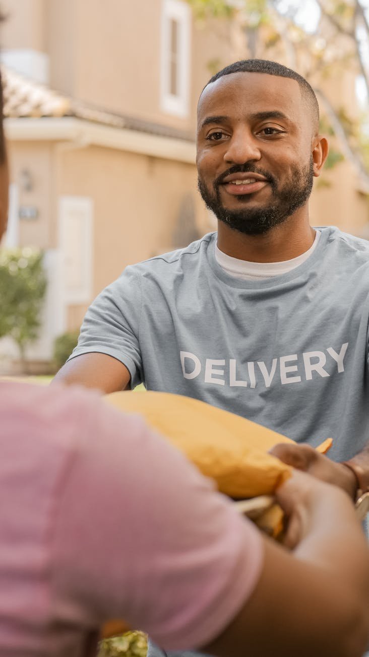a bearded man delivering a package