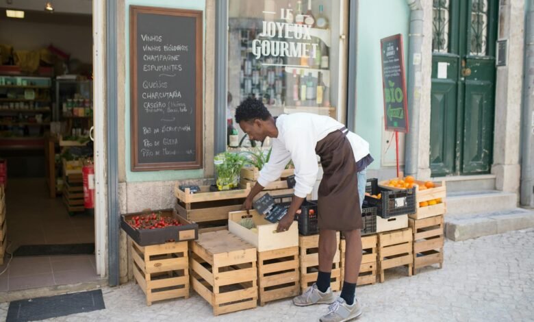 a man fixing trays outside a store