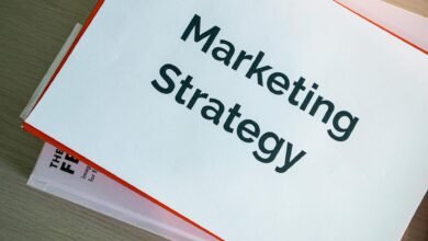 binders with marketing materials on table