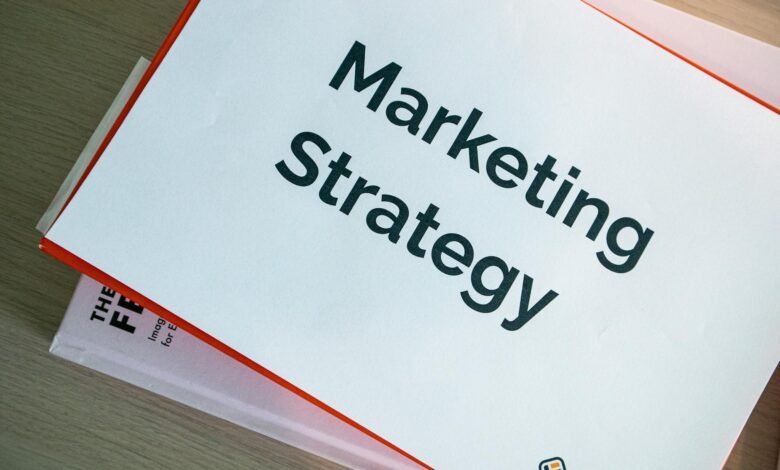 binders with marketing materials on table