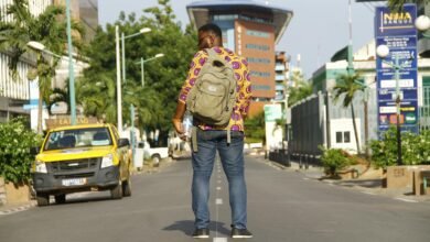 man standing in middle of the road