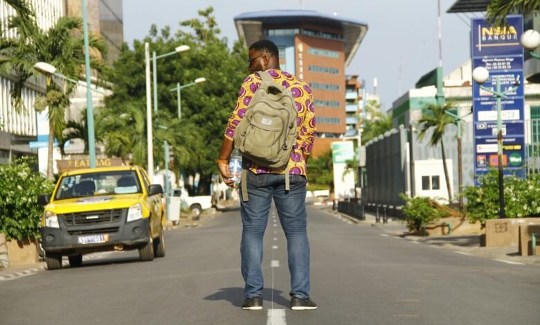man standing in middle of the road