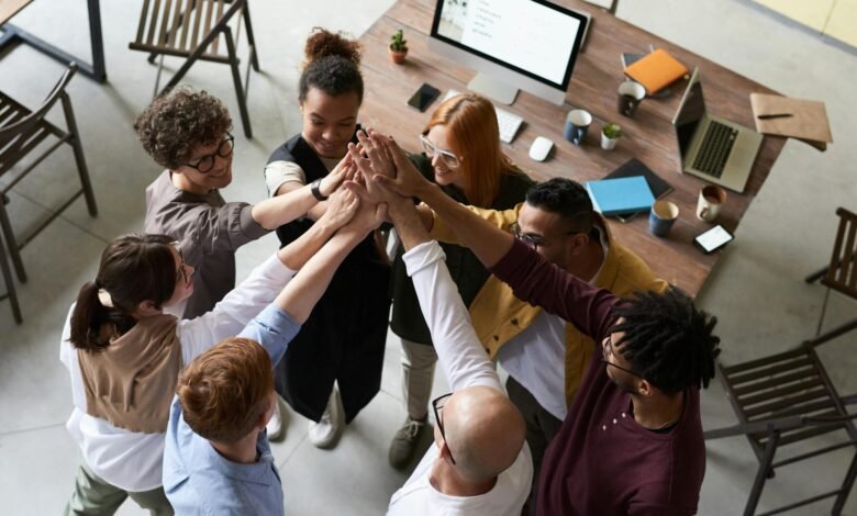 photo of people holding each other s hands