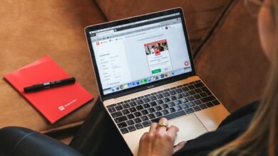 person using laptop on lap