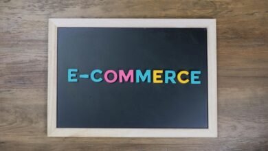 e commerce sign on black background board