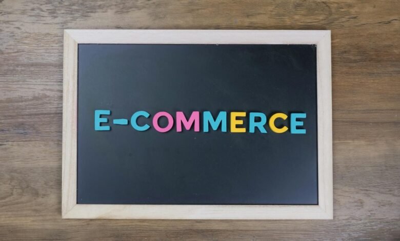 e commerce sign on black background board