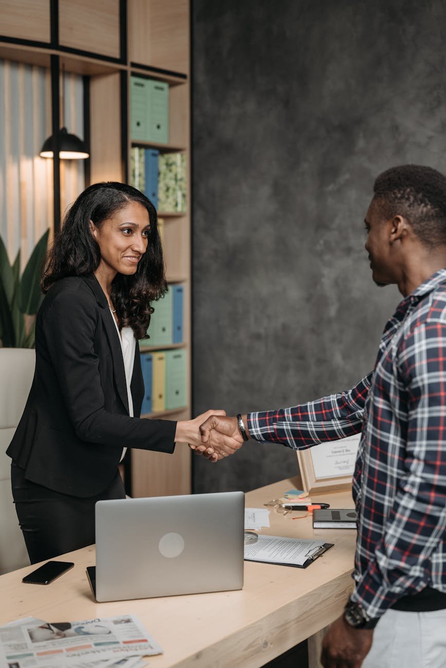 a woman handshake with the client
