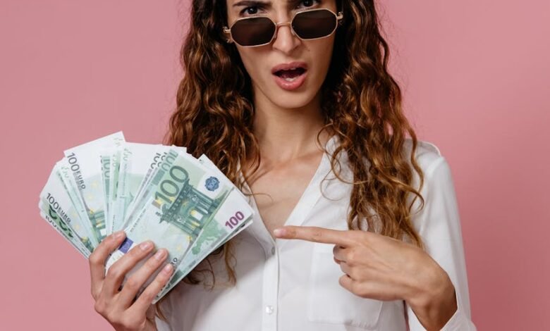 a woman in white long sleeves holding money