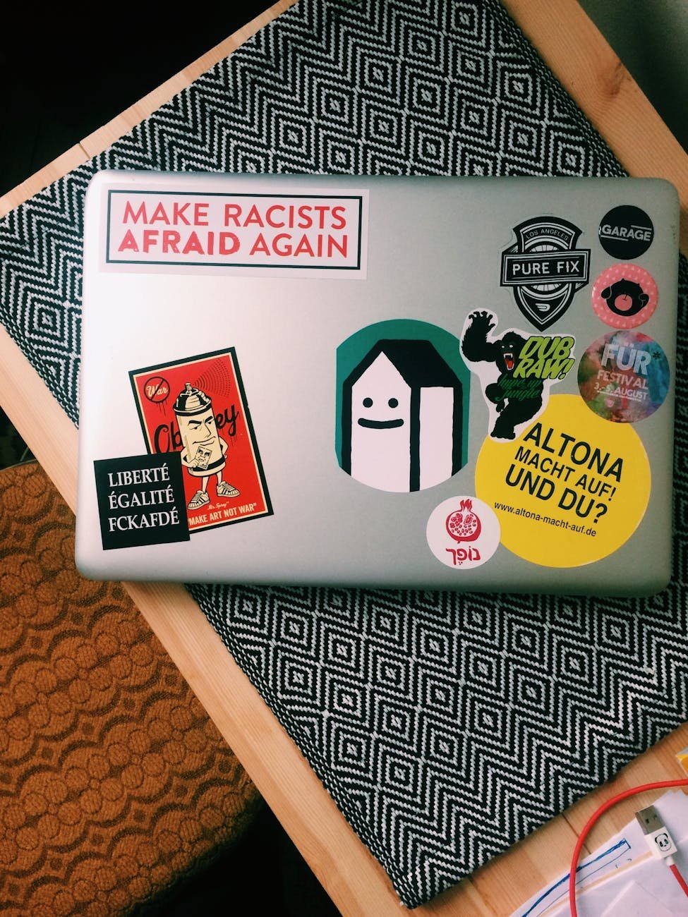 macbook pro with different stickers