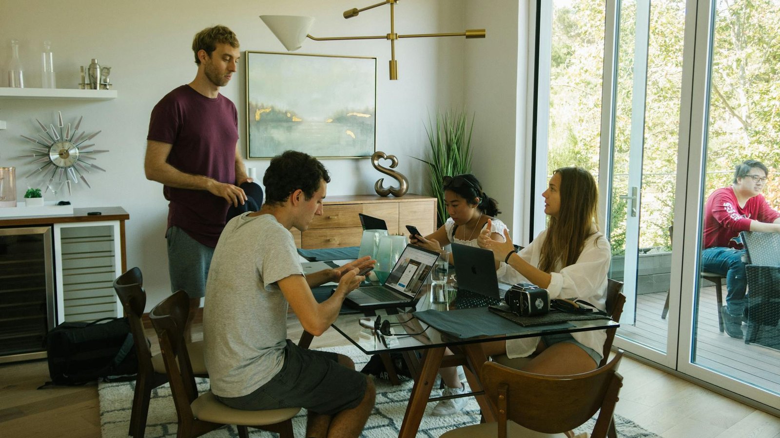 two women and two men sitting in front of a table