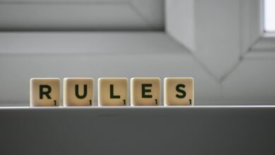similar cubes with rules inscription on windowsill in building