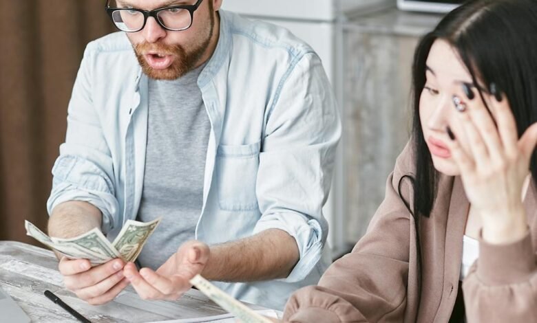 man and woman holding a money