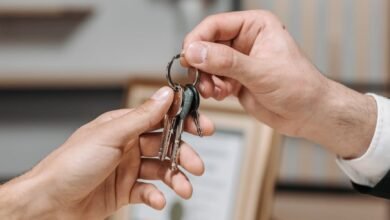 a person giving keys to another person