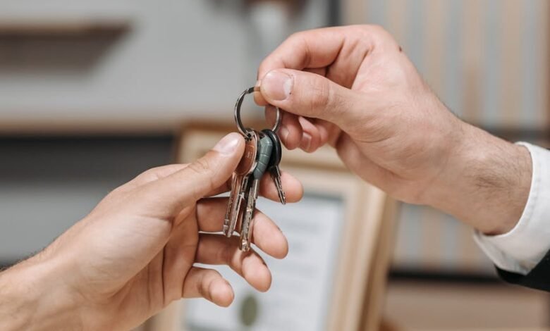 a person giving keys to another person
