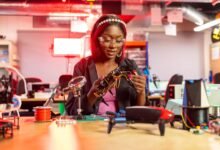 woman holding handmade drone in hand