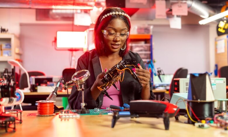 woman holding handmade drone in hand