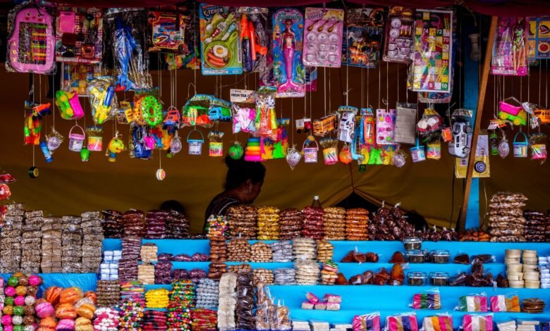 vibrant market stall with sweets and toys in guatemala