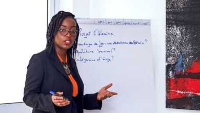 woman in black blazer talking