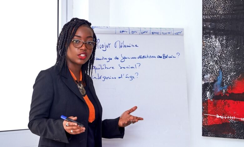 woman in black blazer talking