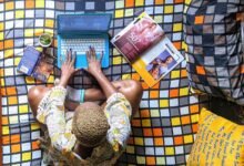 overhead shot of a woman working on her laptop