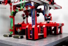 a red and black machine with wires and wires